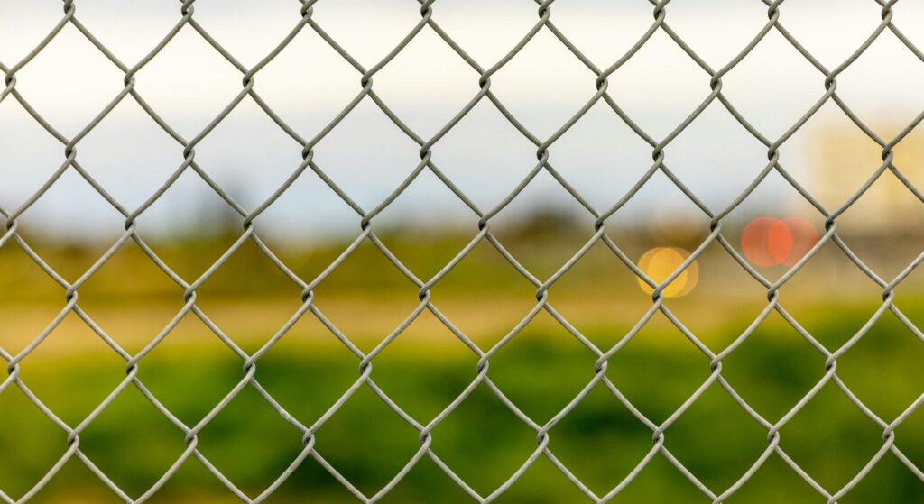 looking through a chain link fence