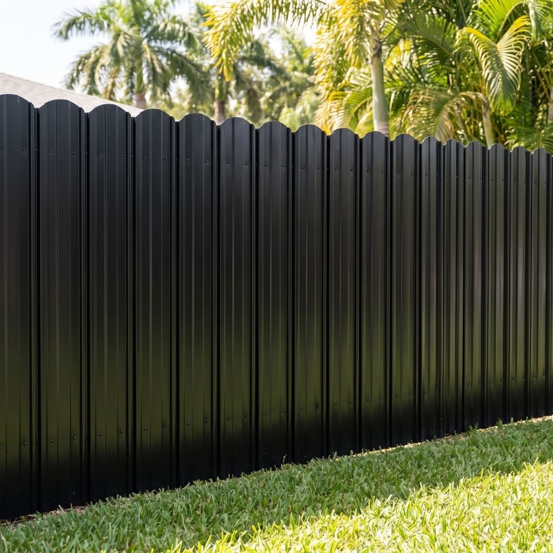 A dark colored residential fence.